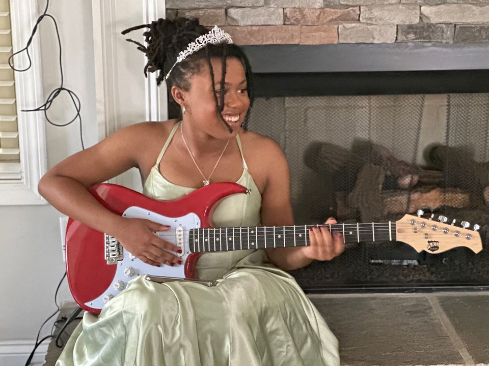 daughter-playing-guitar-in-princess-dress